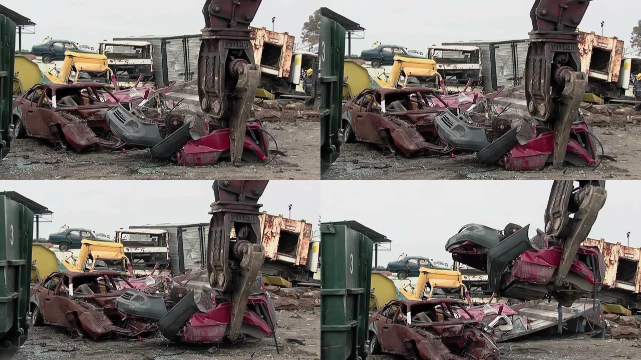 巨型液压垃圾场起重机在废料场吊起一辆旧废车。4k分辨率。