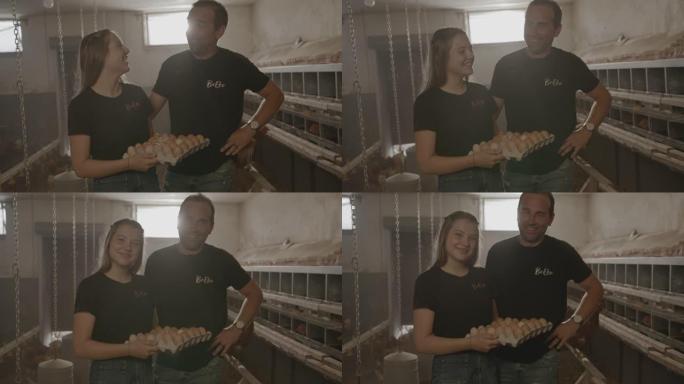 SLO的父亲和女儿在蛋鸡农场里采摘新鲜鸡蛋时摆姿势