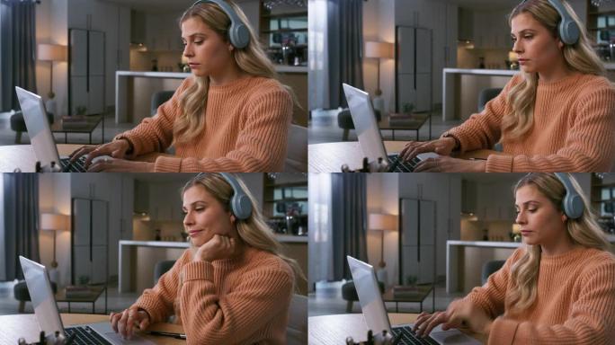 4k视频片段，一名妇女在家里的笔记本电脑上打字时戴着耳机