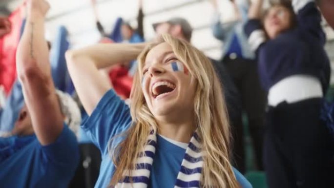 体育馆足球比赛: 美丽的高加索球迷女孩肖像，法国国旗彩绘，为球队获胜欢呼。一群球迷大喊，庆祝进球，赢