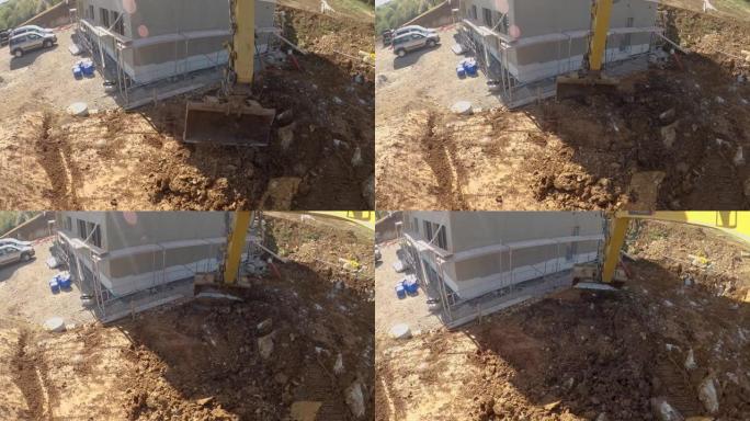 POV: 推土机臂与开沟铲斗在建筑工地挖土。
