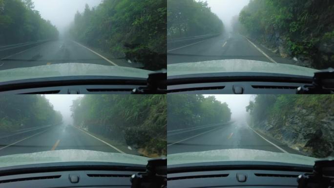 汽车在雾山上行驶挡风玻璃视角山林公路雨天