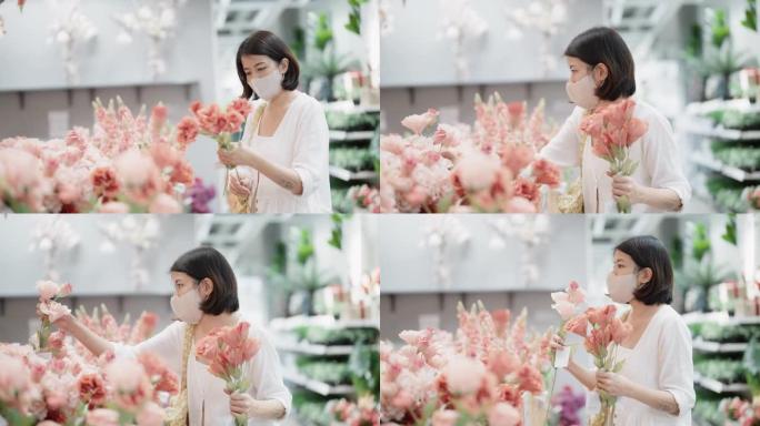 亚洲女花店准备一束鲜花。