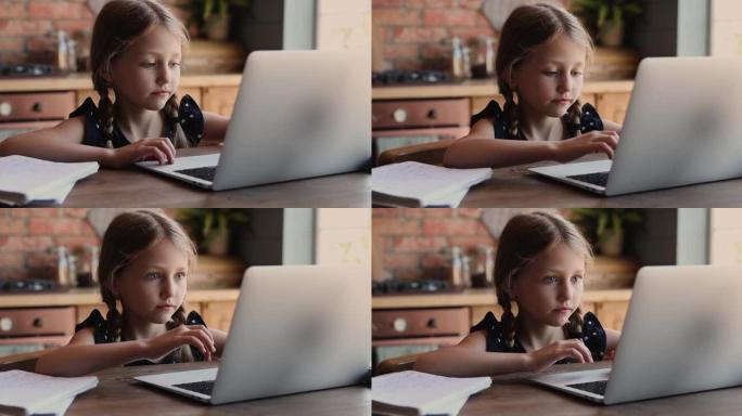 可爱的7岁小孩用电脑，在家学习。