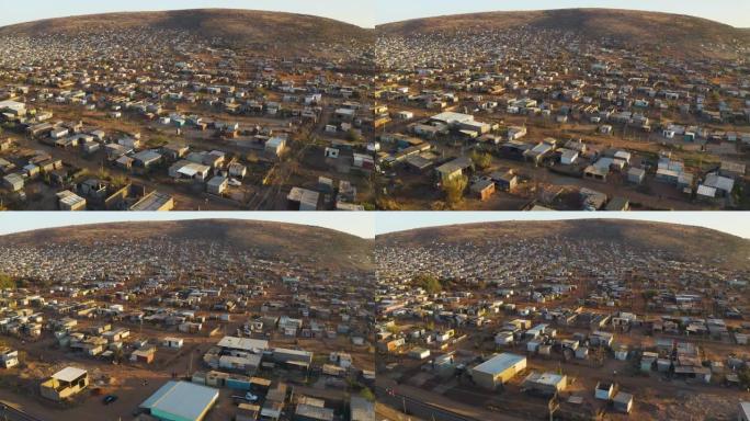 在拥挤且人口稠密的Mamelodi非洲小镇 (棚户区) 上不断蔓延的空中平移视图，南非