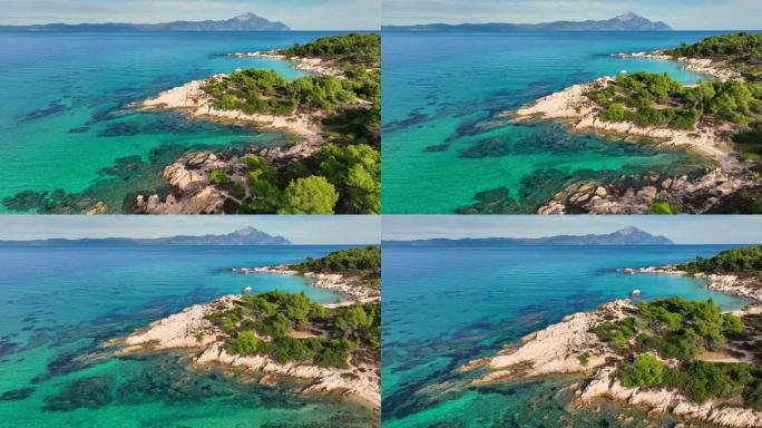 在希腊哈尔基迪基 (Halkidiki) 的小型僻静海滩Sitonia上飞越蓝色泻湖。用绿松石水，沙