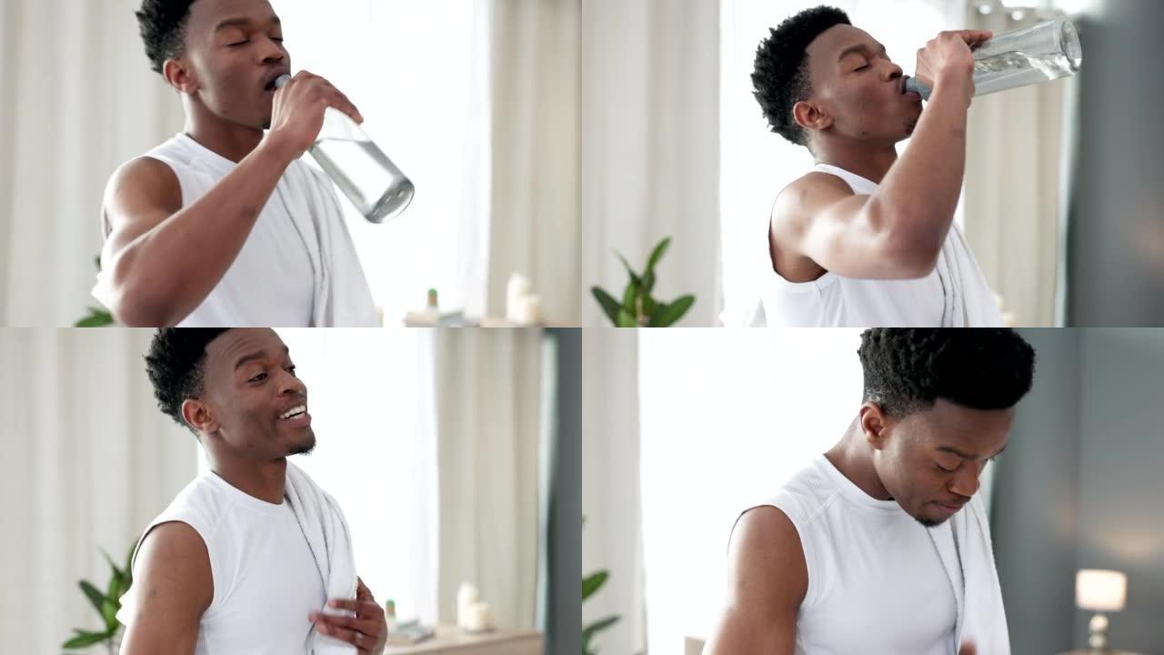 男子在健身锻炼后从瓶子里喝水，训练锻炼后用液体补充能量，运动后用毛巾清洁。快乐，微笑和运动动力的Ar