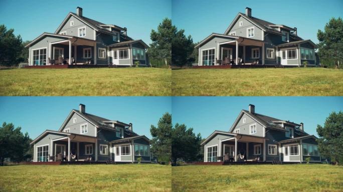 建立镜头: 在一个醒目的夏日，蓝天蔚蓝的美式乡村别墅。美丽的住宅区家园。低角度弧形镜头中的房地产。