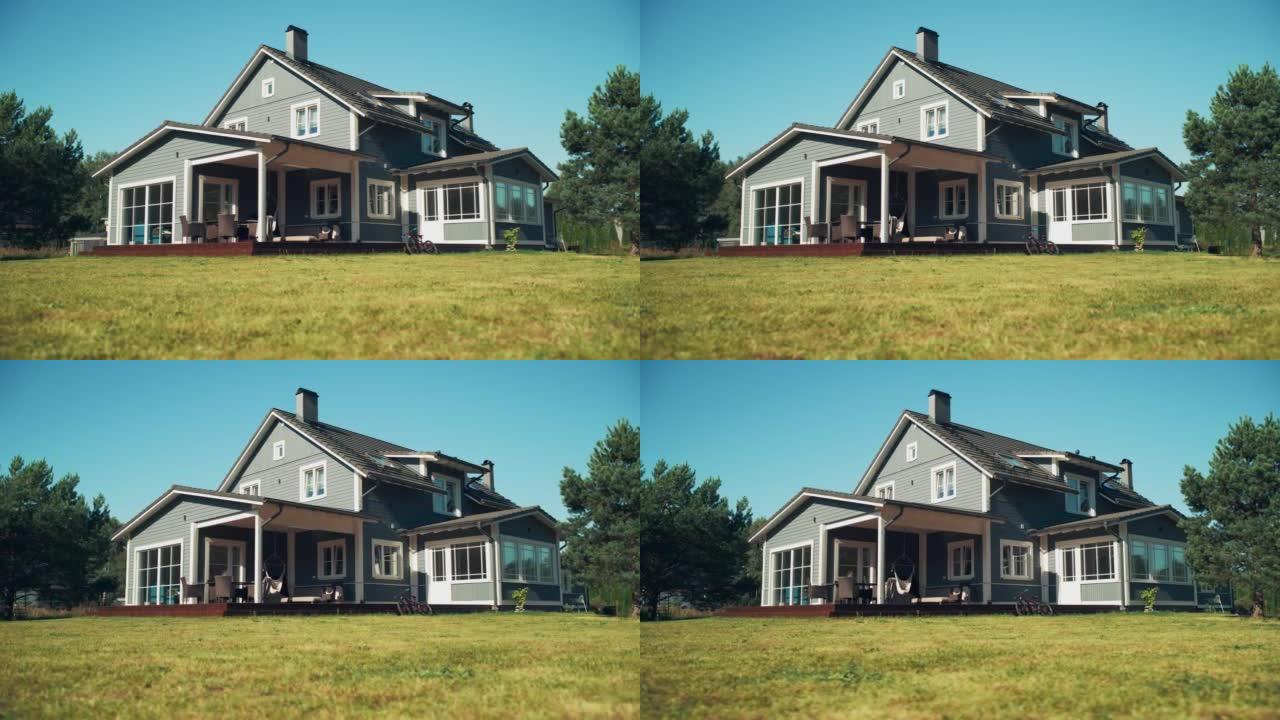 建立镜头: 在一个醒目的夏日，蓝天蔚蓝的美式乡村别墅。美丽的住宅区家园。低角度弧形镜头中的房地产。