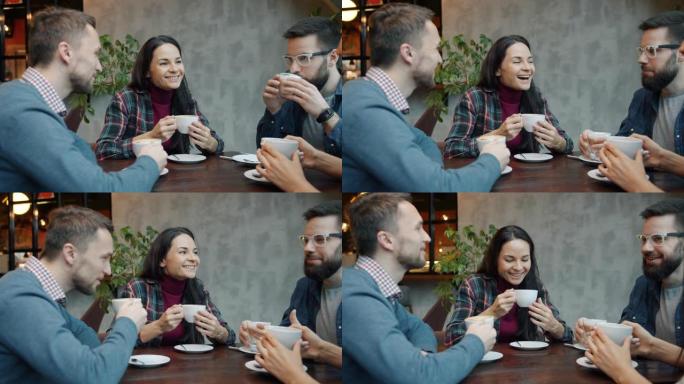 快乐的朋友男女在咖啡馆的餐桌上聊天和喝咖啡