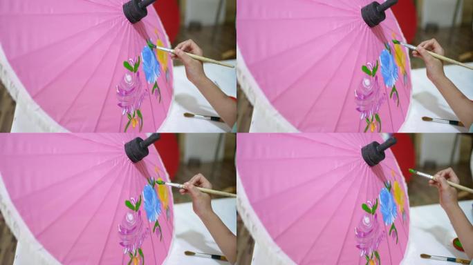 女孩在雨伞上画艺术品