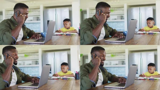 非洲裔美国父子在智能手机上做作业，一起使用笔记本电脑