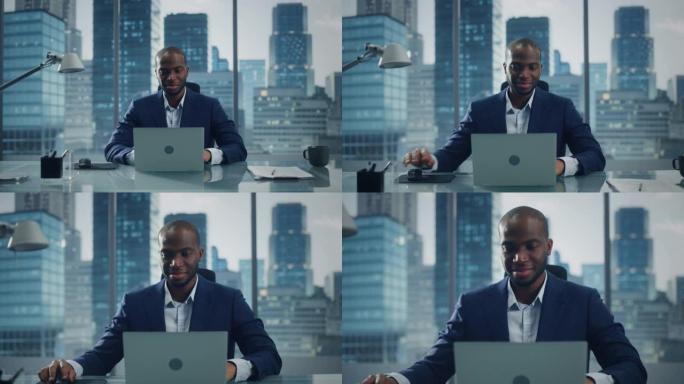 成功的黑人商人在他的大城市办公室里在笔记本电脑上工作的肖像。专业数字企业家为电子商务战略评估做数据分