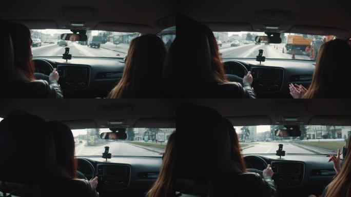 车内后视，戴着口罩的女出租车司机在开车和沿着城市街道转弯时与乘客交谈。