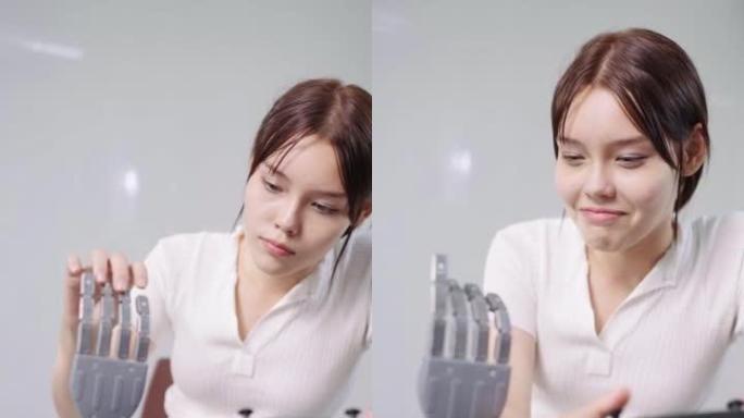 一名高中女生使用操纵杆控制机器人手，并满意地触摸手指。