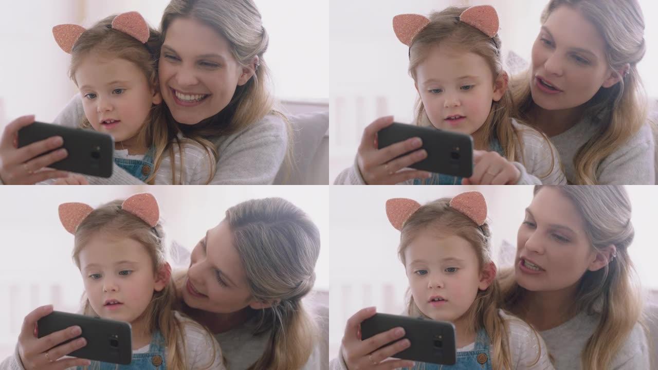 母亲和孩子使用智能手机进行视频聊天小女孩与妈妈挥舞着分享假期周末与女儿享受在手机上聊天4k镜头