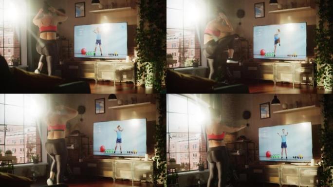 家庭健身房: 华丽的超大身材积极的女孩通过在线视频教程与私人教练训练。正宗的女人使用锻炼服务健身应用