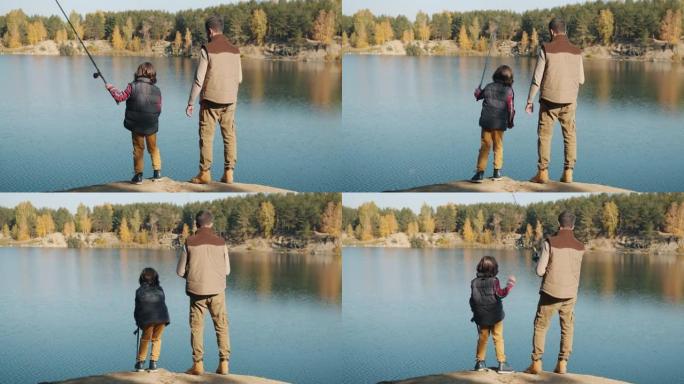 阳光明媚的秋天，成年男子和小男孩在湖里钓鱼的后景