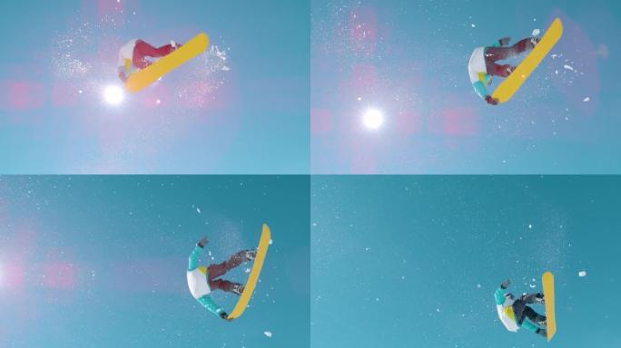 自下而上: 金色的阳光照射在极端的滑雪板上，进行旋转抓斗