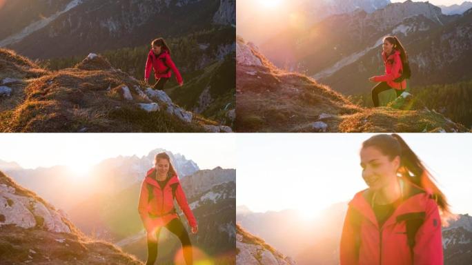 Fit young woman hiking on a mountain trail with ma