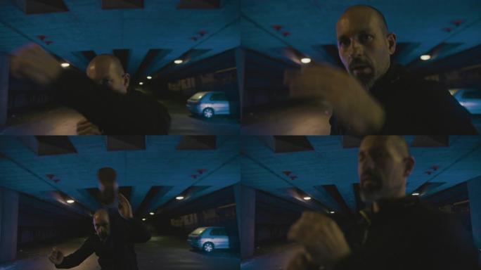 SLO MO Mid成年男子晚上在空荡荡的停车场进行太极拳