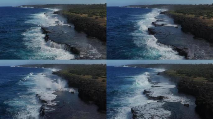 海浪的航拍在暴风雨来临前坠入荒岛的岩石悬崖。
