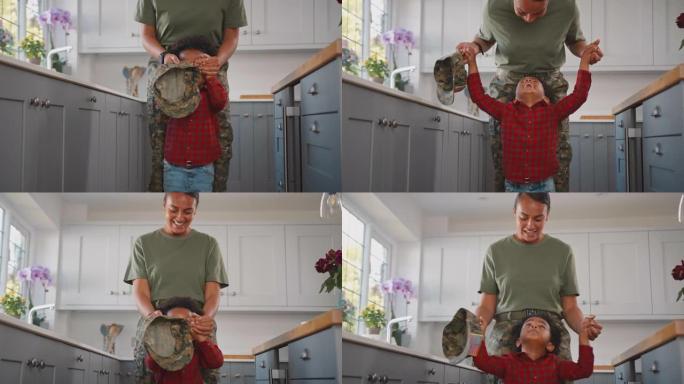 美国军队母亲休假回家，儿子穿着制服在家庭厨房里玩耍-慢动作拍摄