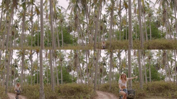 骑自行车探索热带岛屿女孩骑自行车享受美丽的棕榈树森林4k