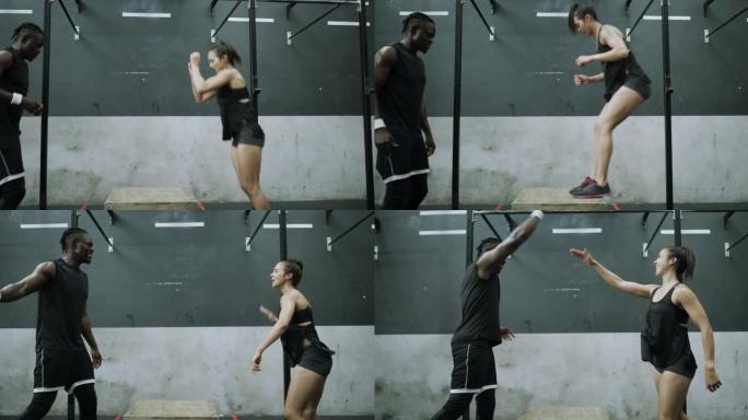 一个年轻男女在健身房一起跳箱的4k视频片段