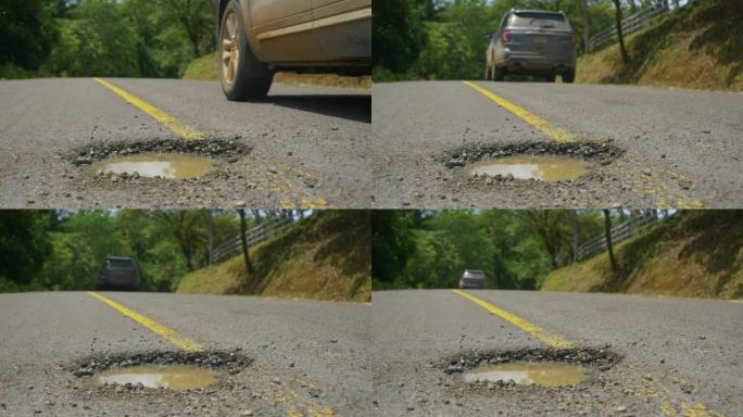 特写，dop: 4x4车辆在探索巴拿马时躲开了道路上的一个大洞。