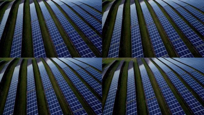 空中无人机的视点太阳能电池板在黄昏时分成排的太阳能农场