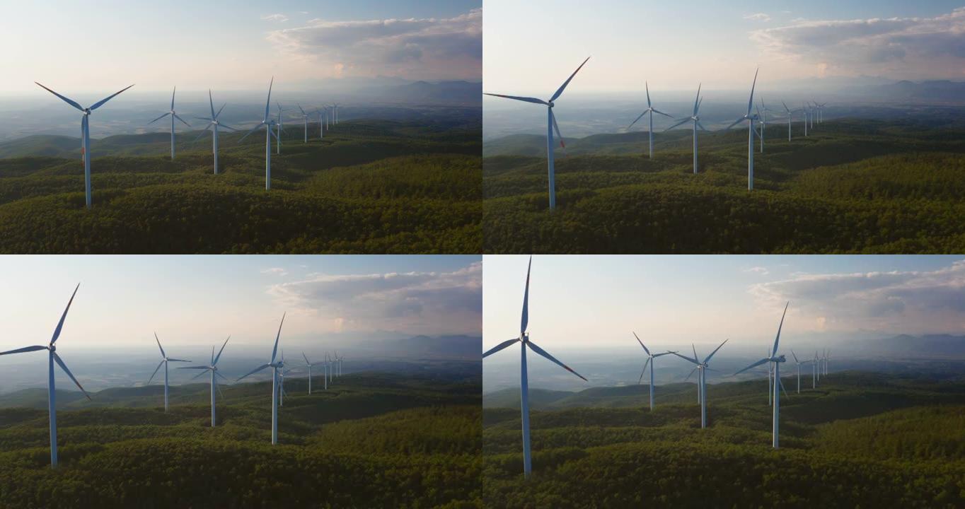 风车在风力作用下旋转的空中拍摄，并以绿色生态的方式向太阳照耀着地球产生可再生能源。