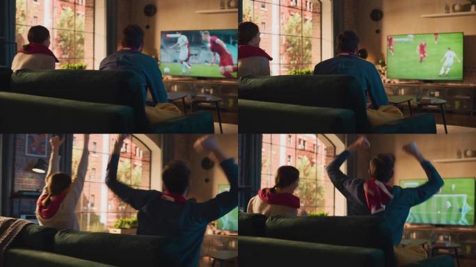 几个足球迷在沙发上放松，在时尚的阁楼公寓里在家观看体育比赛。激动的年轻男女为他们最喜欢的足球俱乐部欢
