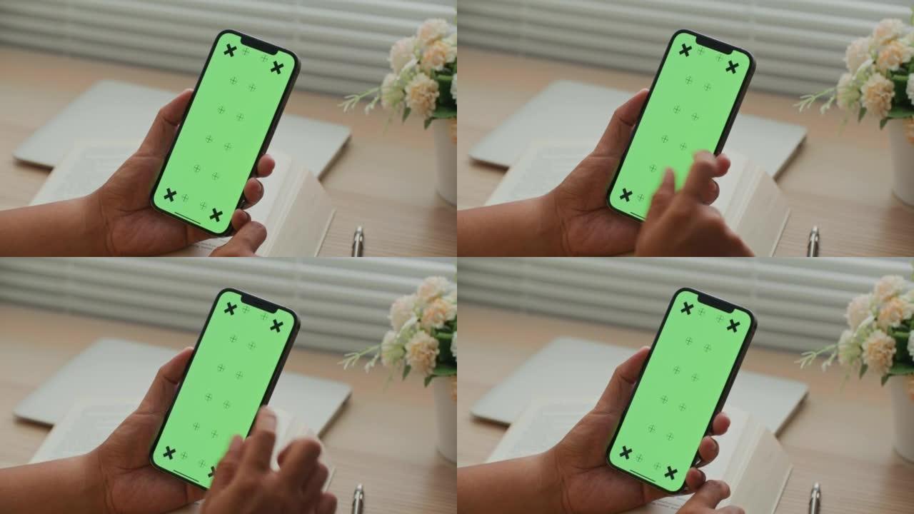 男人在绿屏手机上使用应用程序