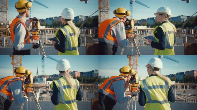 建筑工人使用经纬仪测量光学仪器测量建筑工地上水平和垂直平面的角度。工程师和建筑师在测量师旁边使用平板