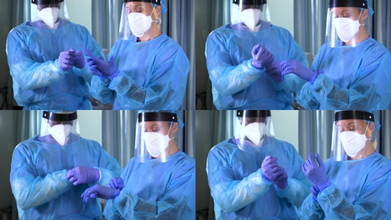 两名多种族的医护人员穿上完整的PPE