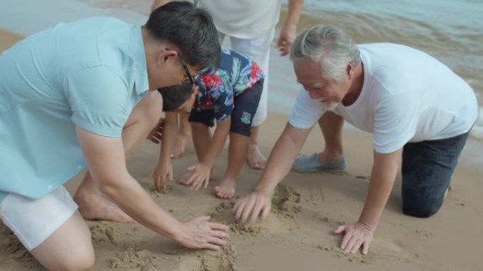 多代家庭在海滩上玩得开心