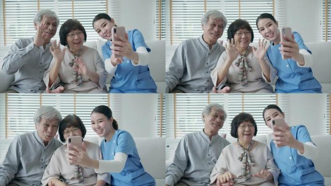 亚洲老年夫妇和护士护理手持手机自拍视频