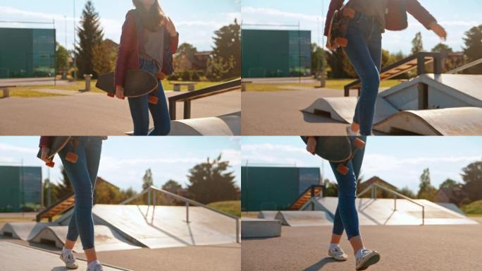 在滑板公园里背着滑板的少女