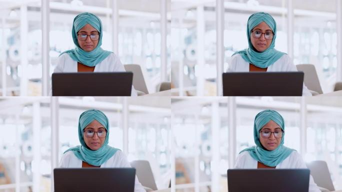 穆斯林商业女性，专注于笔记本电脑，电子邮件和沟通与思想和技术。戴头巾的工人，公司目标与互联网，电子邮