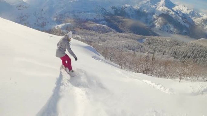 慢动作: 朱利安阿尔卑斯山偏远地区的极端女骑手滑雪板。