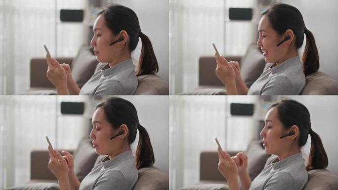 亚洲女人在家用智能手机聊天