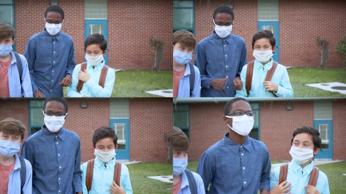 三个中学生男孩戴着面具在户外散步，说话