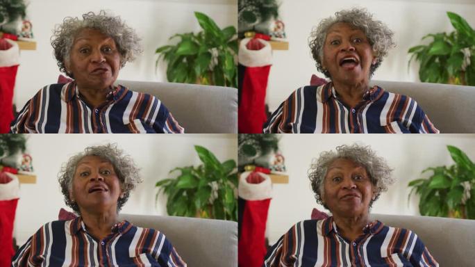 快乐的非洲裔美国高级妇女打手势的动画，在圣诞节时进行视频通话