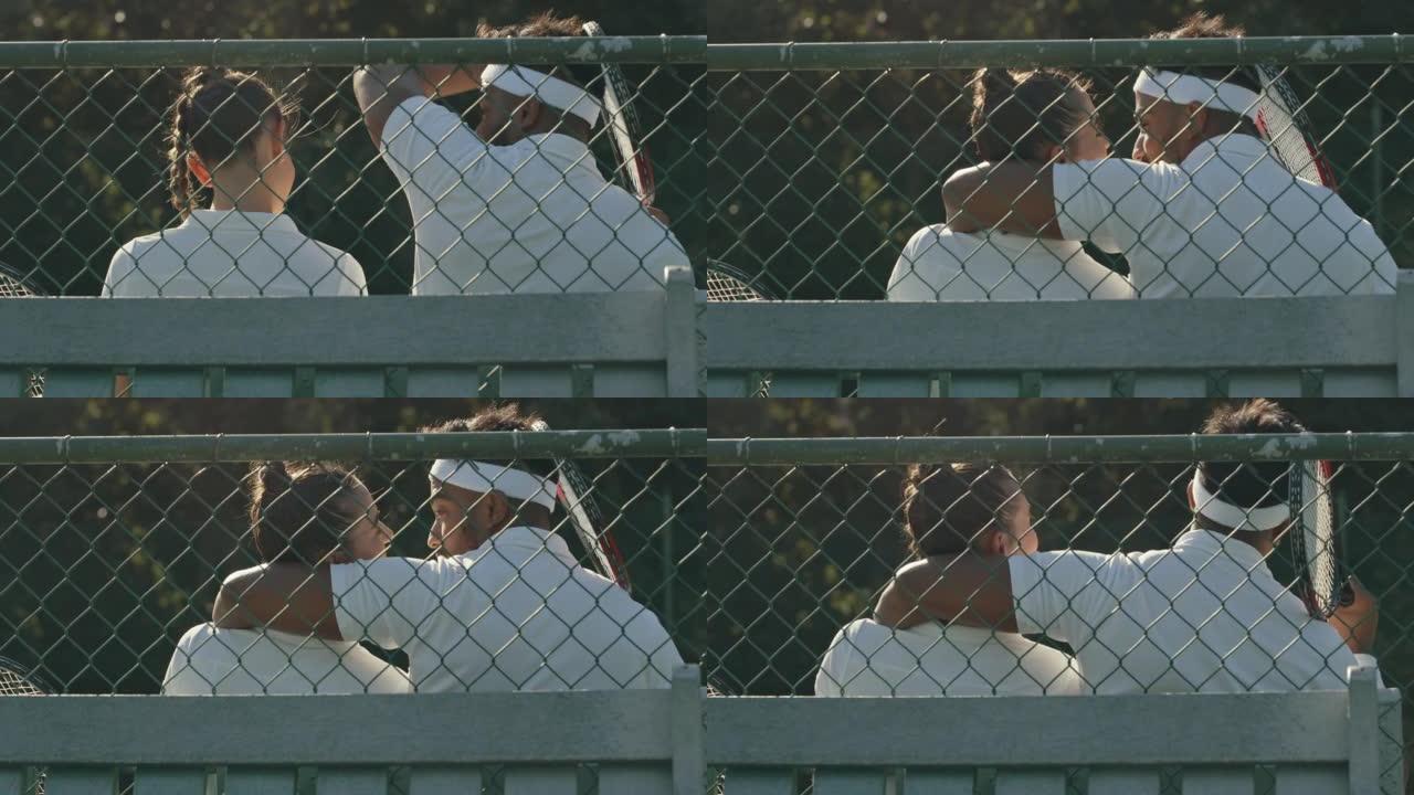 一对年轻夫妇在球场上打网球后放松的4k视频片段