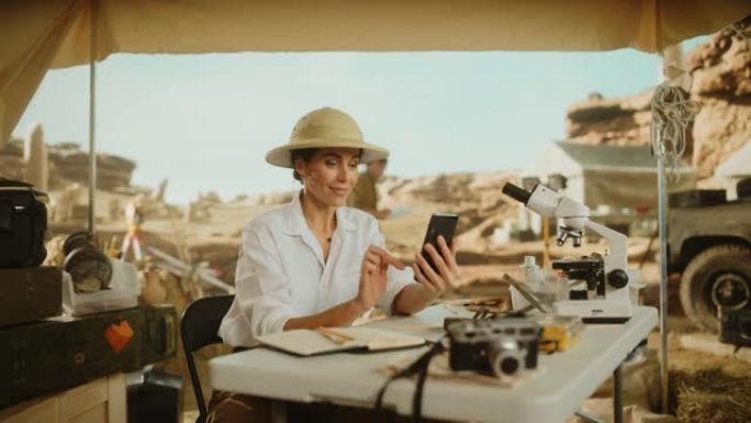 考古挖掘地点: 著名的女性考古学家进行研究，使用智能手机在互联网社交媒体上发布化石遗骸的发现，古代文