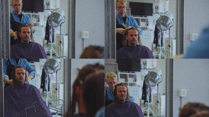 发型师在美容院为男性顾客梳理头发