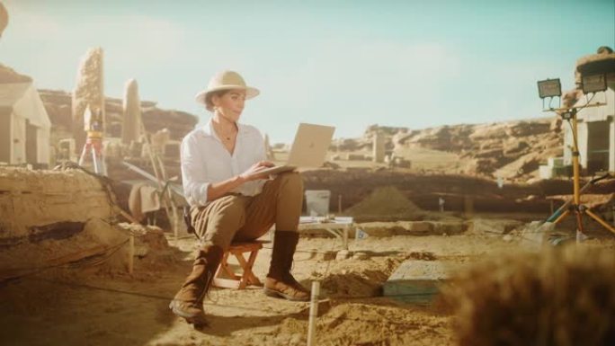 考古挖掘现场盘古: 美丽的女考古学家做研究，用笔记本电脑，分析出土的古代文明文化文物。发掘现场的伟大