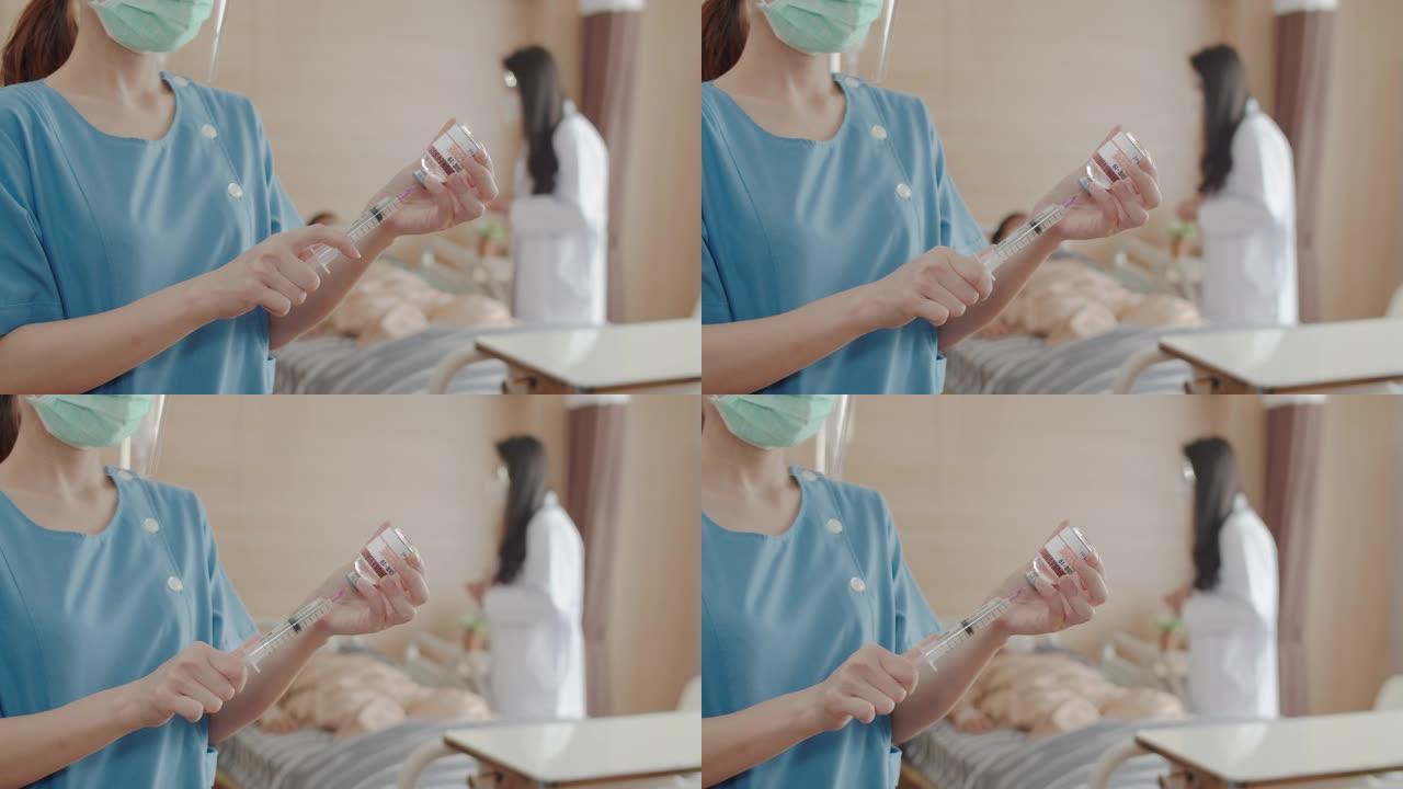 近距离护士的手和注射器正在给医院的病人接种电晕病毒