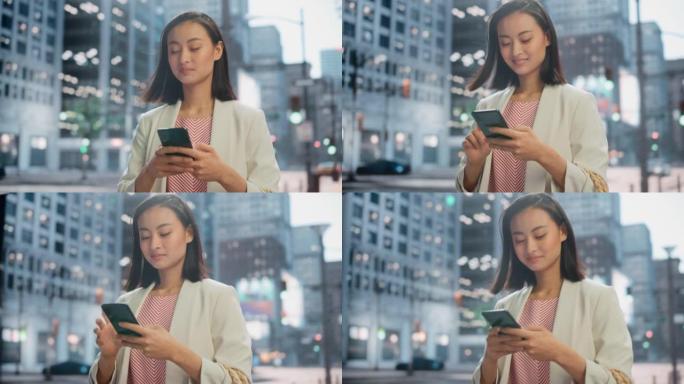 一位迷人的日本女性穿着时髦的休闲服，在城市街道上使用智能手机的肖像。大城市的经理与人们在线联系，消息